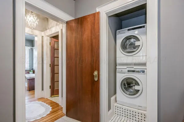 a bathroom with a sink a mirror and a window