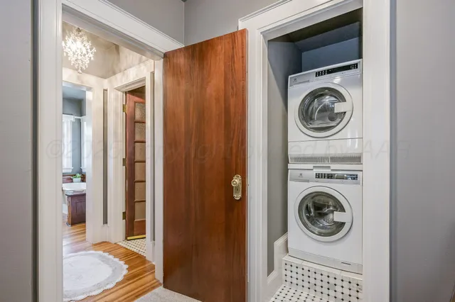 a bathroom with a sink a mirror and a window