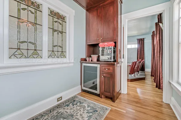 a bed sitting in a bedroom next to a window