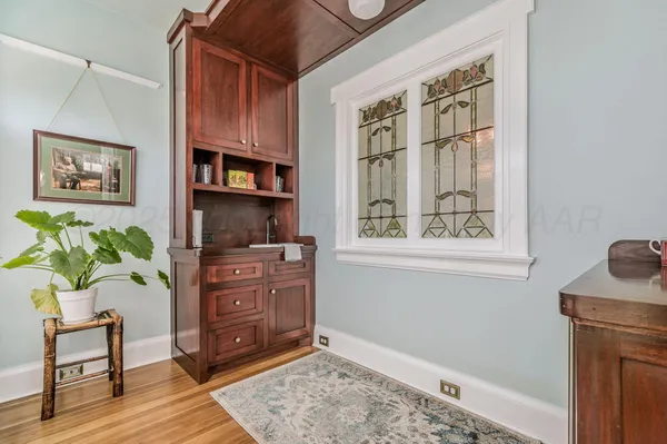 a bathroom with a sink a toilet and a window