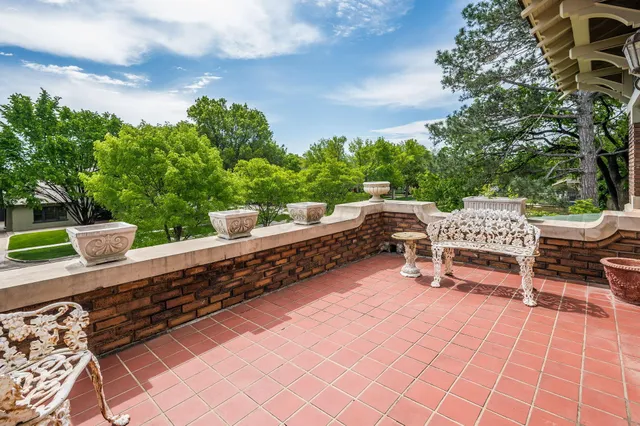 a view of staircase with wooden floor and a front door