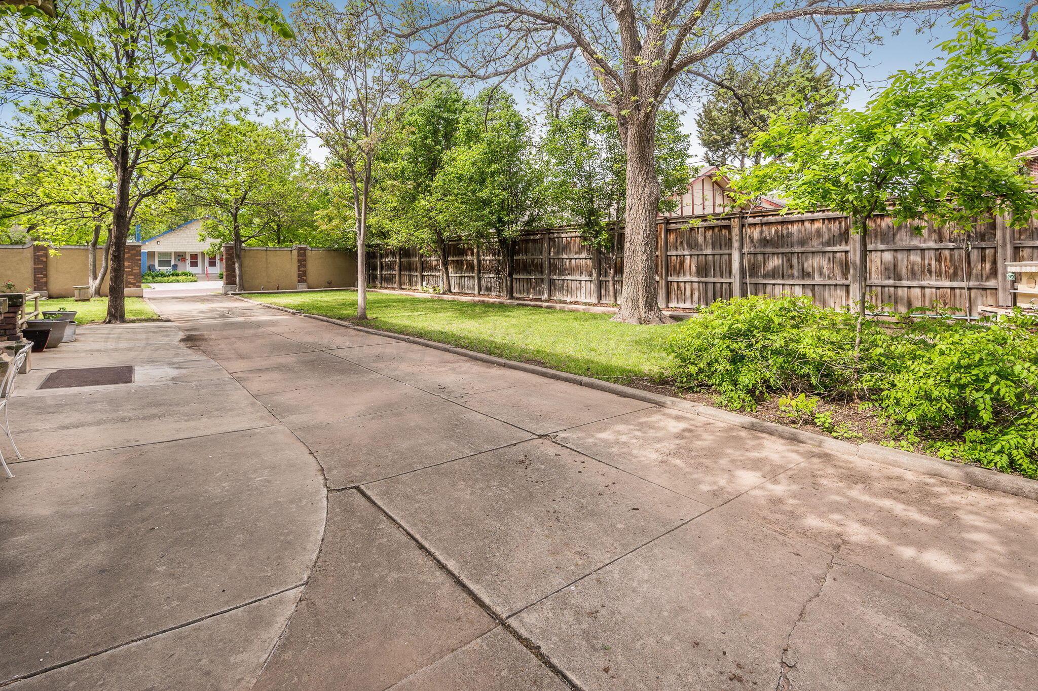 1620 South Tyler Street Amarillo, TX 79102 - Photo 65 of 66 a view of a house with a big yard and large trees