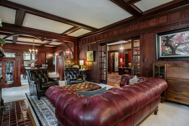 a view of a dining room with furniture and chandelier