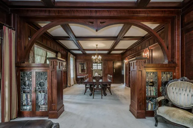 a kitchen with a refrigerator and a stove top oven