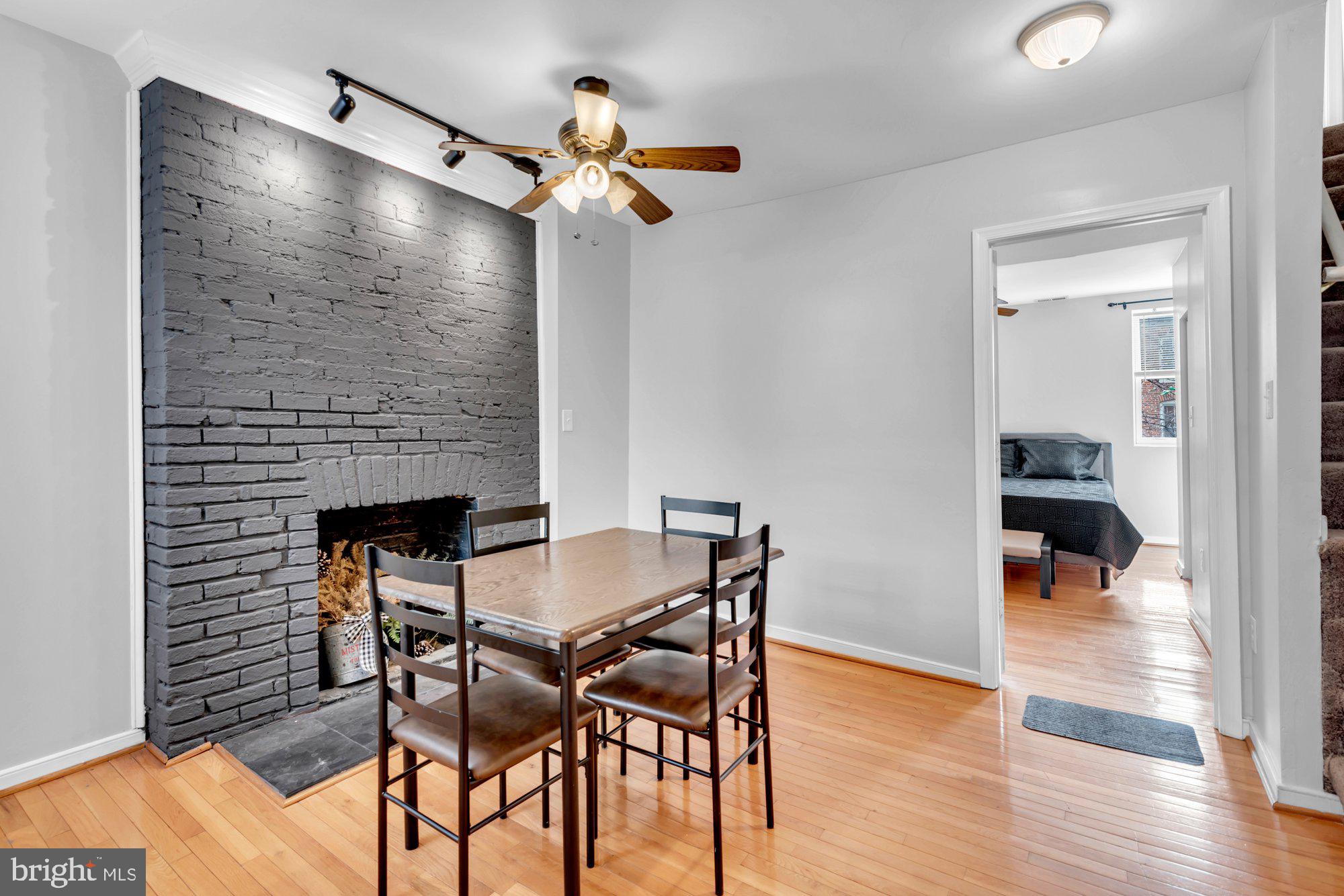 210 West Read Street Baltimore, MD 21201 - Photo 14 of 26 a dining room with furniture and wooden floor