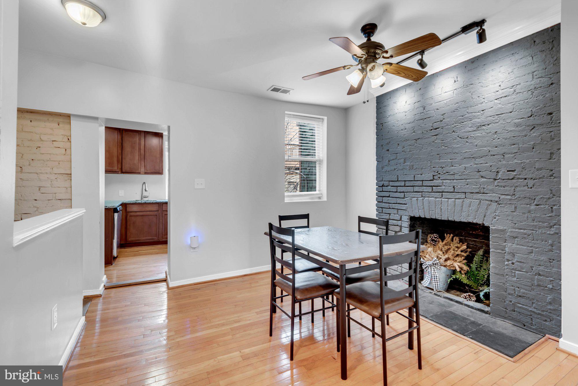 210 West Read Street Baltimore, MD 21201 - Photo 15 of 26 a view of a livingroom with furniture and a fireplace