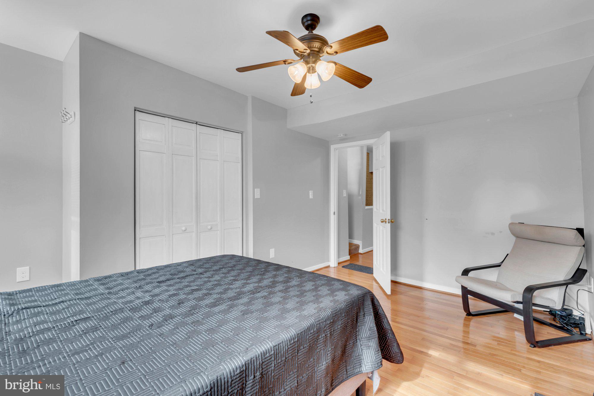 210 West Read Street Baltimore, MD 21201 - Photo 18 of 26 a bedroom with a bed and a chair