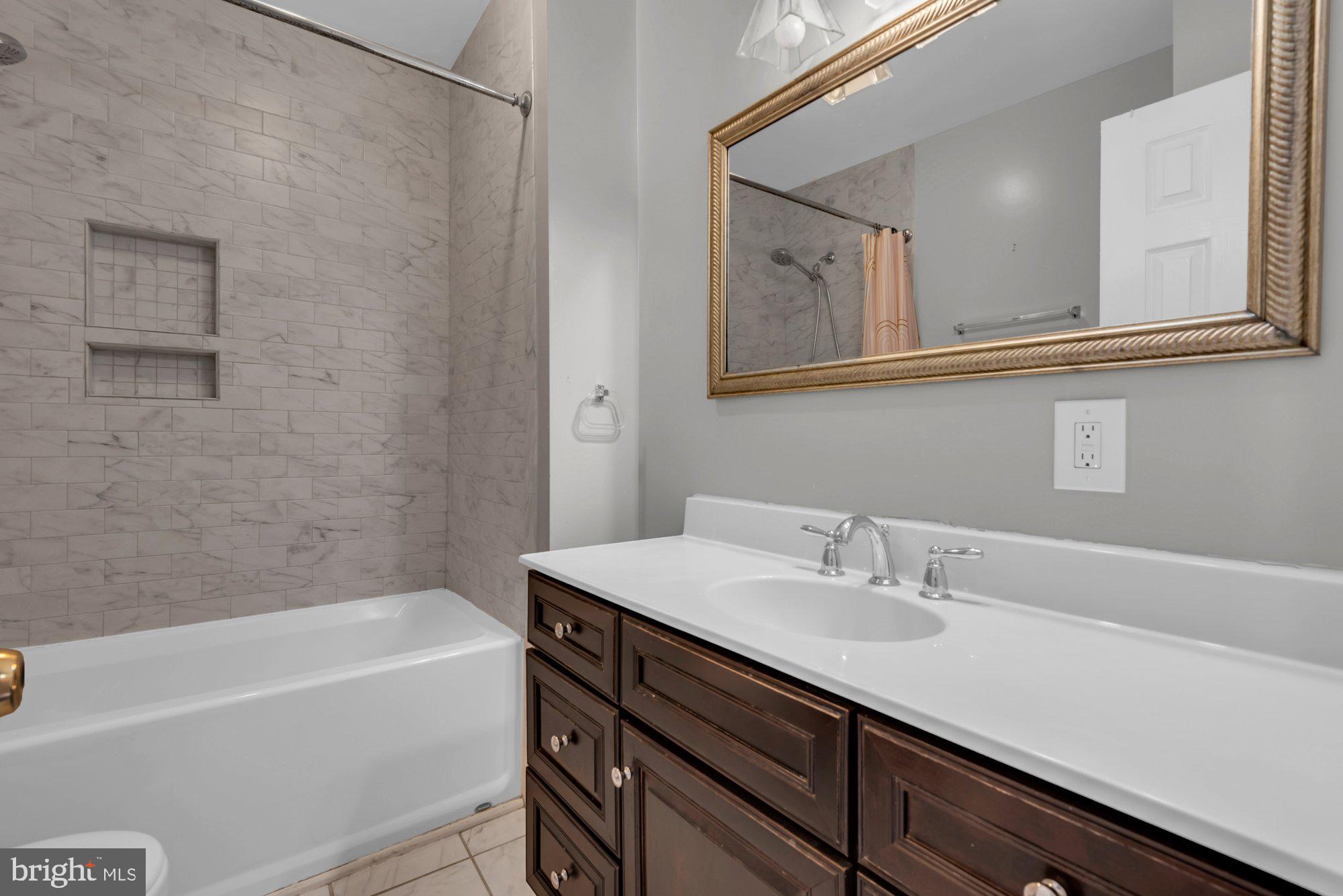 210 West Read Street Baltimore, MD 21201 - Photo 22 of 26 a bathroom with a sink and a bathtub