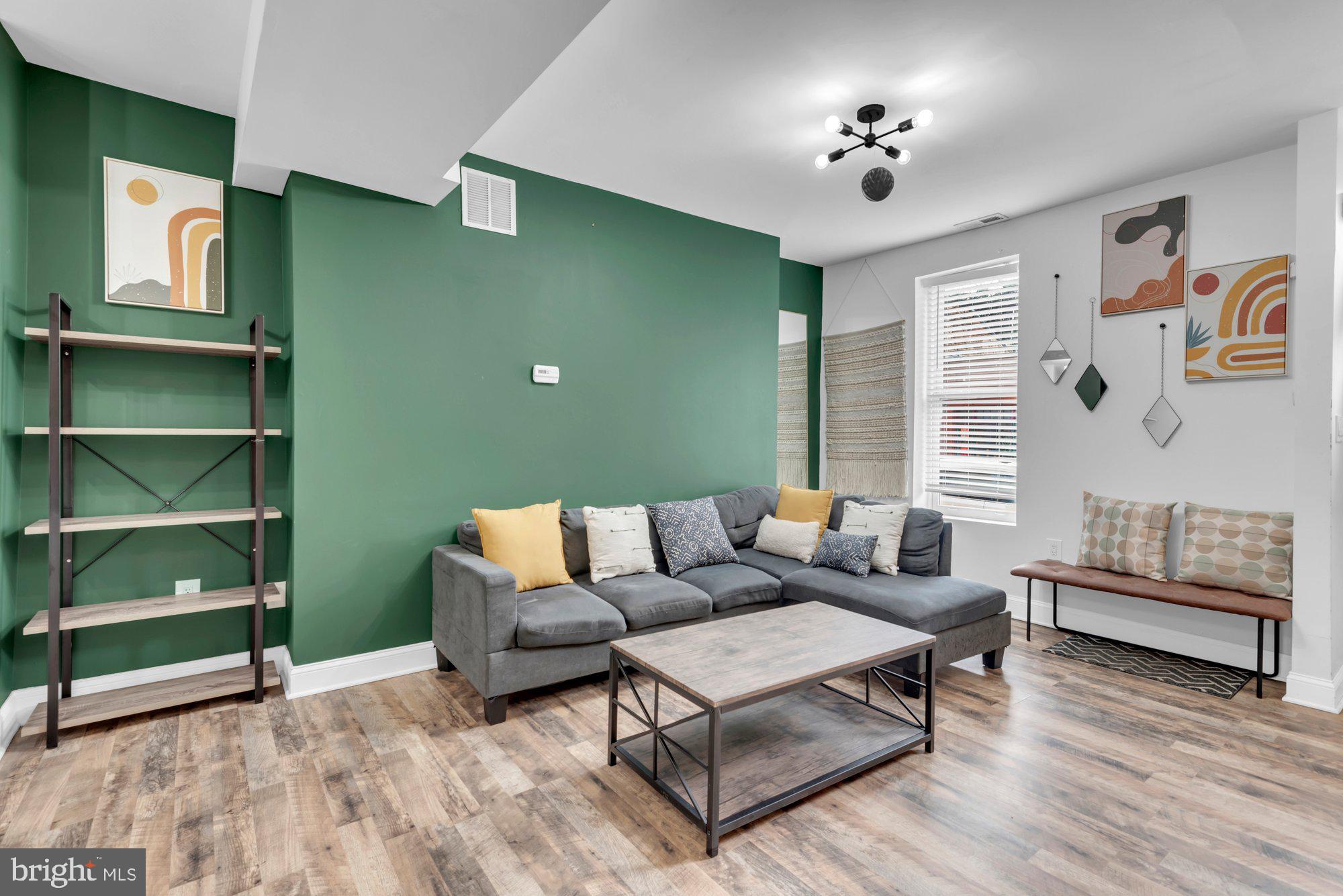 210 West Read Street Baltimore, MD 21201 - Photo 8 of 26 a living room with furniture and a lamp