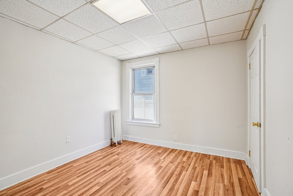 50 Whipple Street Worcester, MA 01607 - Photo 13 of 30 a view of empty room with wooden floor and fan