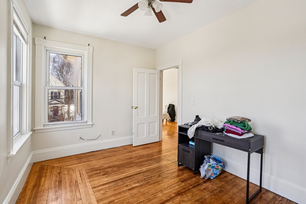 50 Whipple Street Worcester, MA 01607 - Photo 26 of 30 a bedroom with a bed and a window