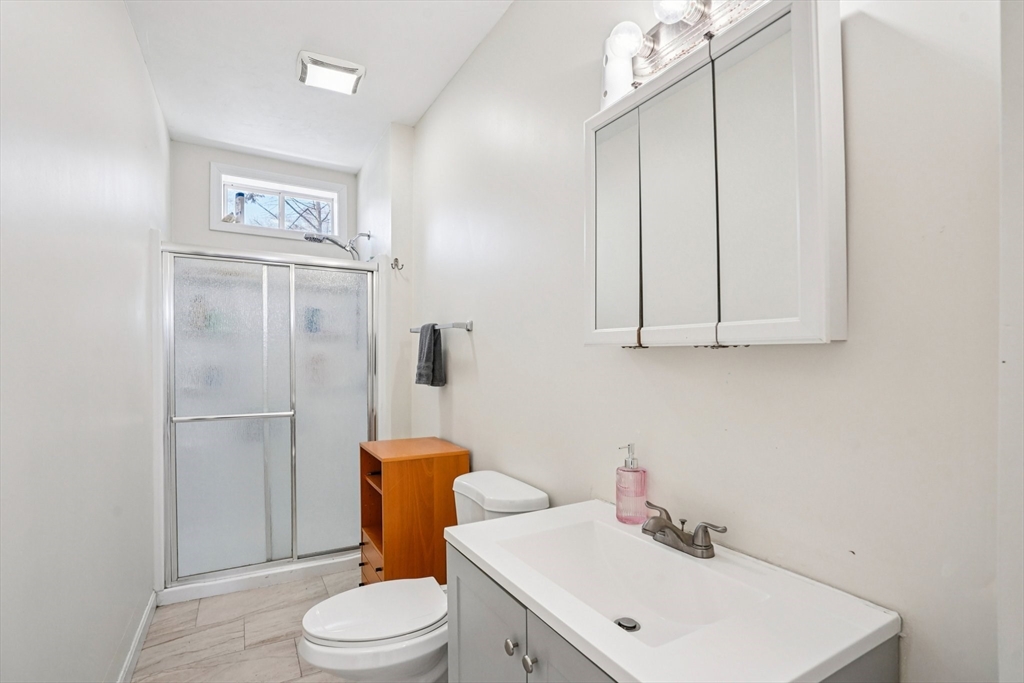 50 Whipple Street Worcester, MA 01607 - Photo 27 of 30 a bathroom with a sink a toilet and shower