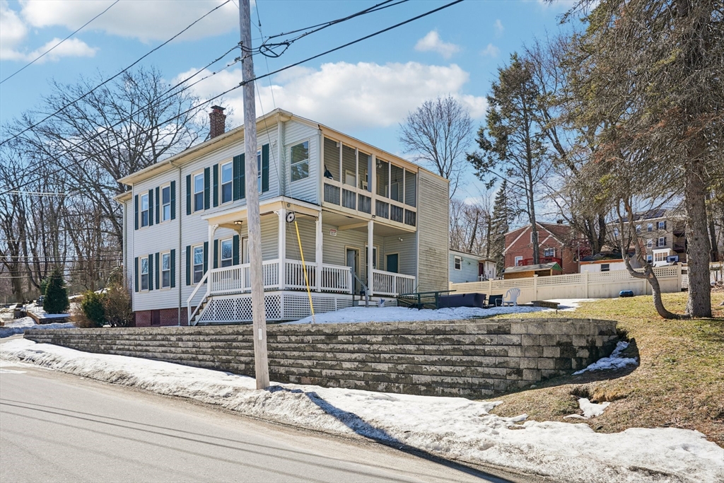 50 Whipple Street Worcester, MA 01607 - Photo 28 of 30 a view of a white building among the street with palm trees