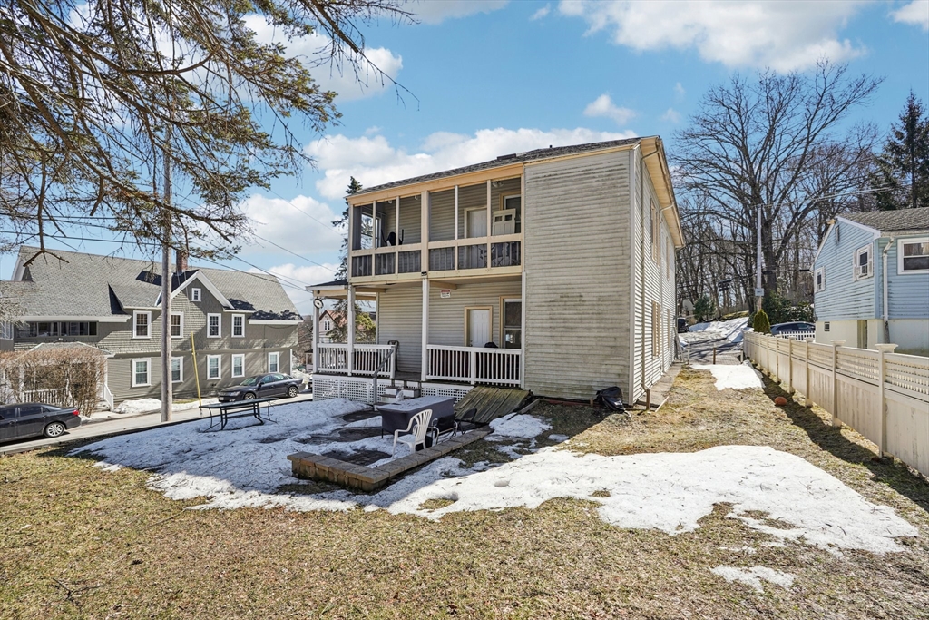 50 Whipple Street Worcester, MA 01607 - Photo 30 of 30 a view of a house with a yard covered in snow