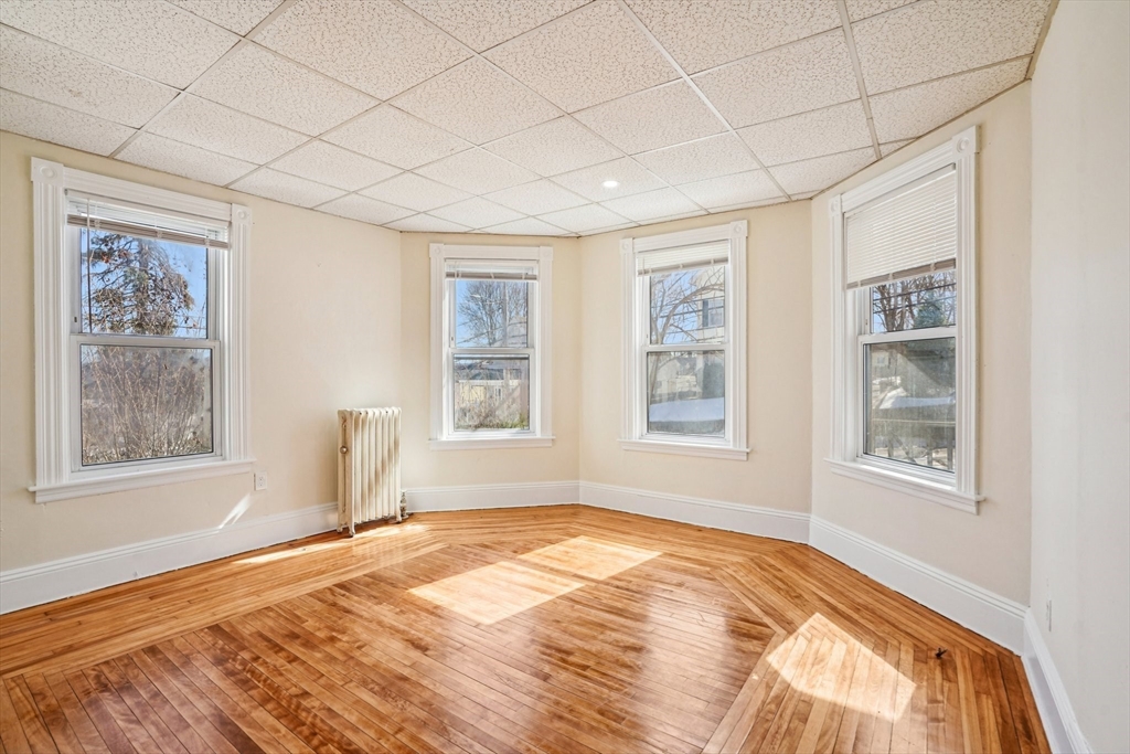 50 Whipple Street Worcester, MA 01607 - Photo 4 of 30 a bedroom with a bed and a window