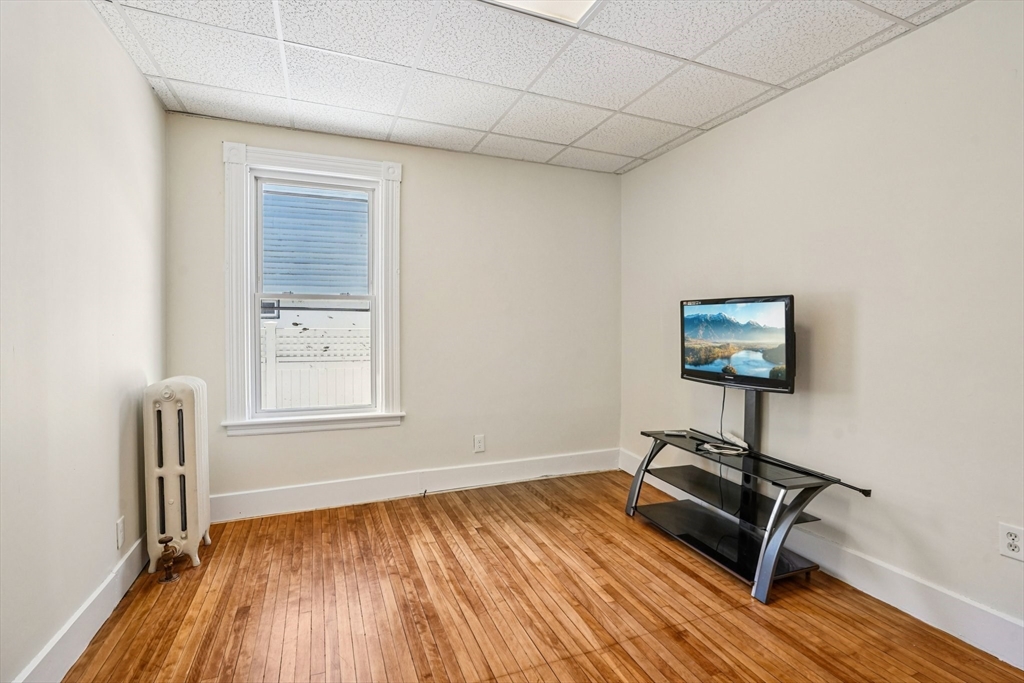 50 Whipple Street Worcester, MA 01607 - Photo 6 of 30 a room with gym equipment and a window