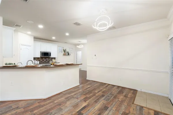 a view of a kitchen with microwave and stove
