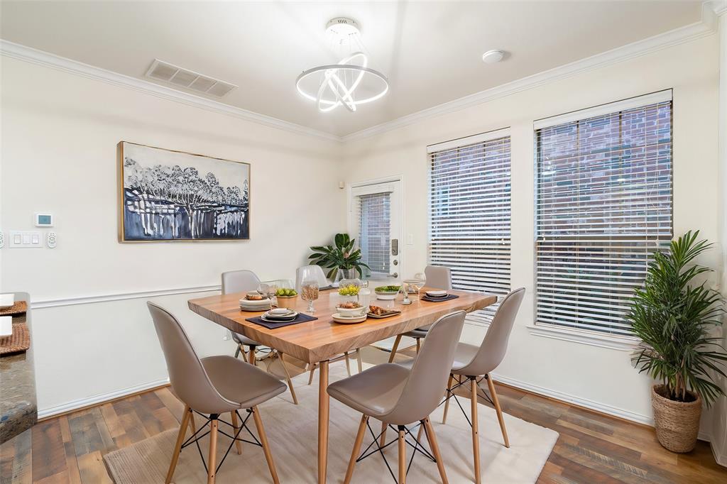 7113 Occidental Road Plano, TX 75025 - Photo 12 of 35 a view of a dining room with furniture window and wooden floor