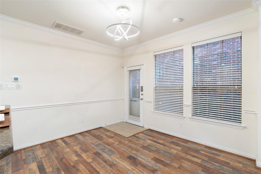 7113 Occidental Road Plano, TX 75025 - Photo 13 of 35 a view of a livingroom with an empty space & a window