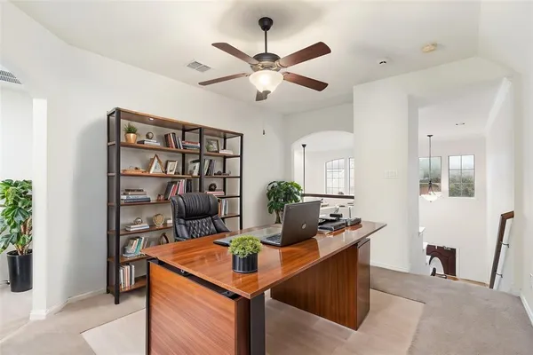a work room with furniture and view