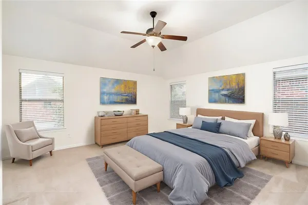 a bedroom with a bed and a couch