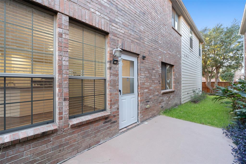 7113 Occidental Road Plano, TX 75025 - Photo 31 of 35 a front view of a house with a garage