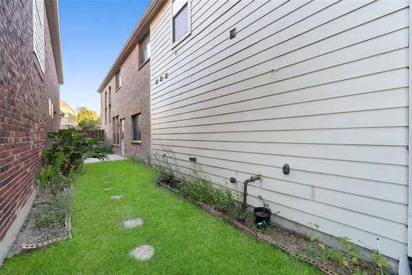 a backyard of a house with lots of green space