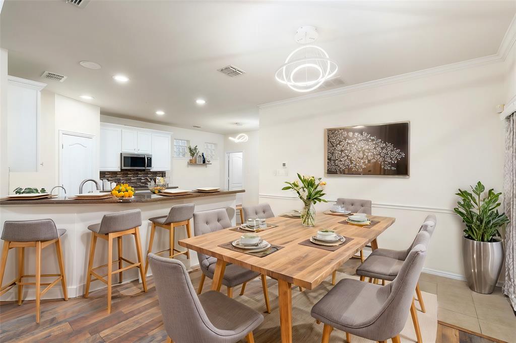 7113 Occidental Road Plano, TX 75025 - Photo 10 of 35 a view of a dining room with furniture