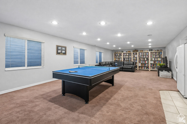 7092 Cherokee Street Eagle Mountain, UT 84005 - Photo 13 of 27 Spacious recreation room featuring recessed lighting, a neutral color palette, and two windows with blinds