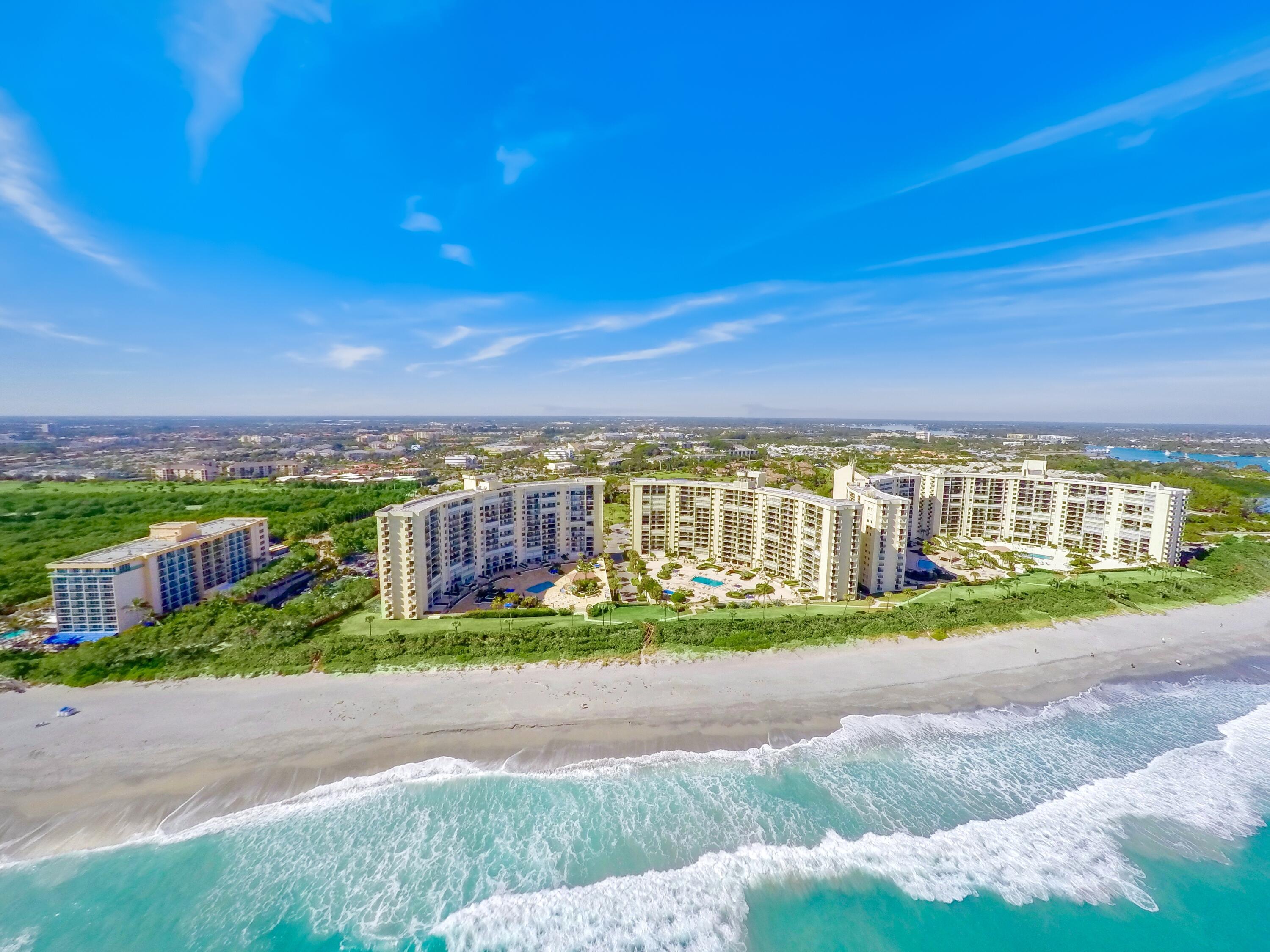 100 Ocean Trail Way, Unit 1010 Jupiter, FL 33477 - Photo 1 of 40 a view of a city with a big yard