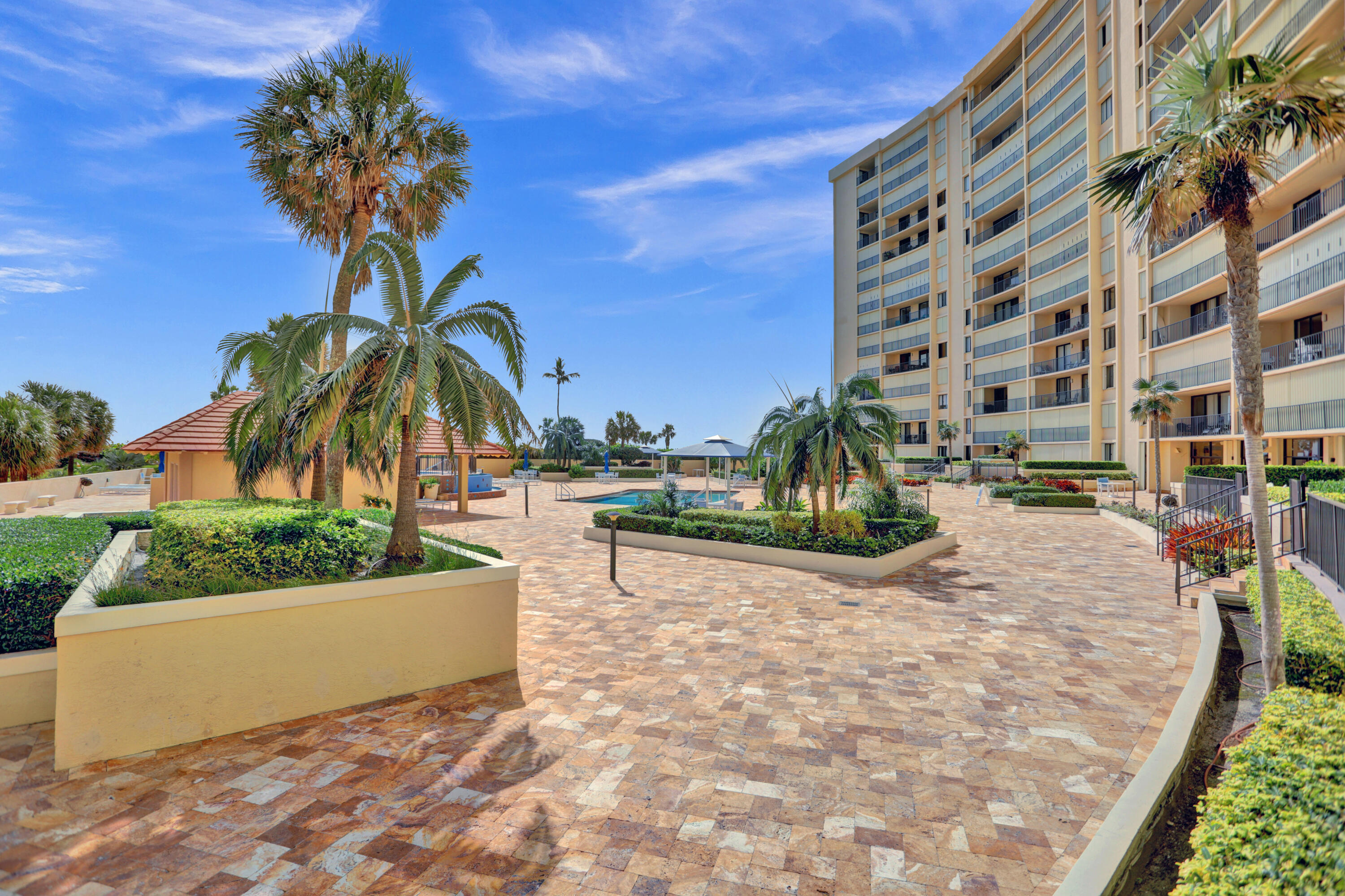 100 Ocean Trail Way, Unit 1010 Jupiter, FL 33477 - Photo 28 of 40 a view of a yard in front of a building