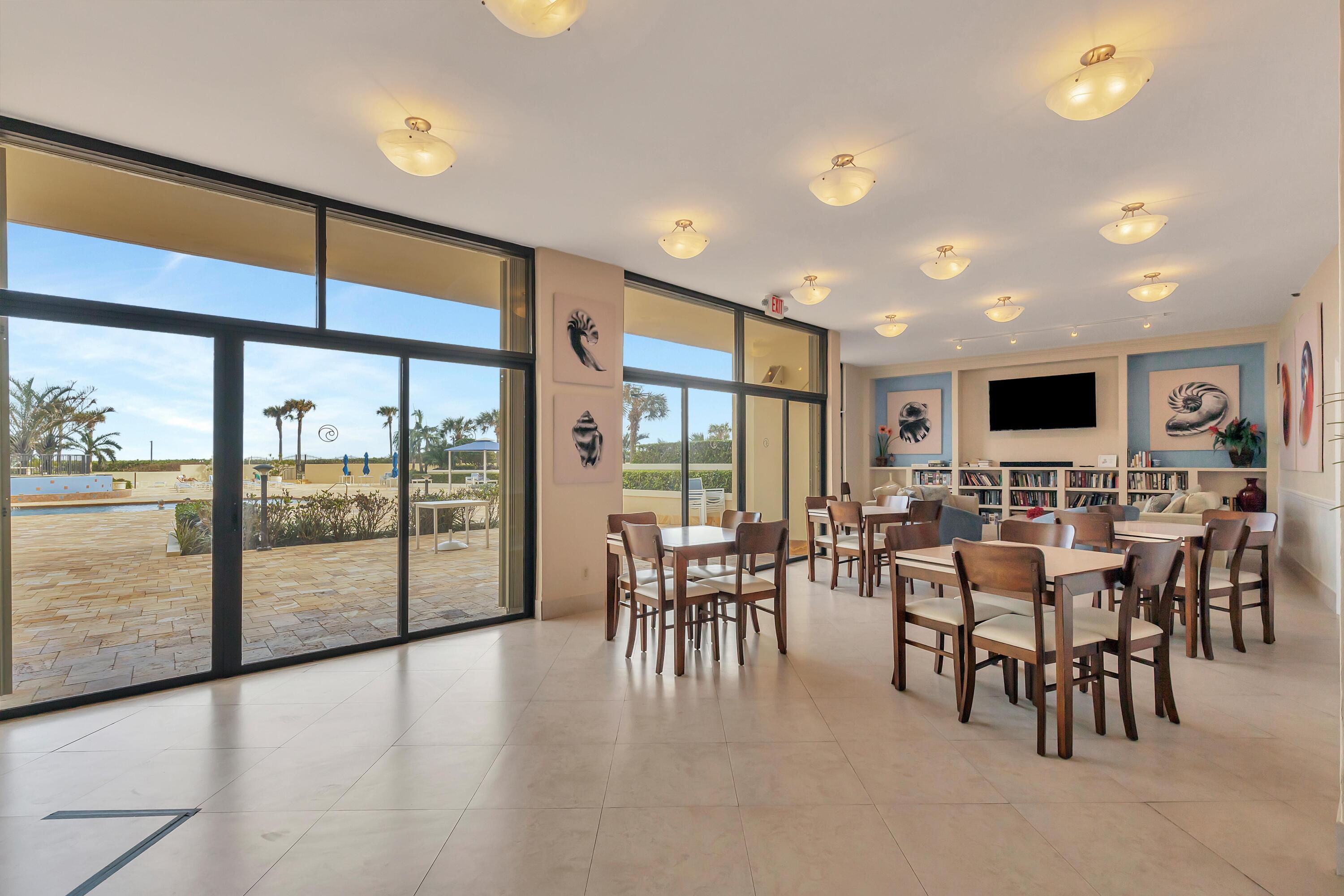 100 Ocean Trail Way, Unit 1010 Jupiter, FL 33477 - Photo 30 of 40 a view of a dining room with furniture window and outside view