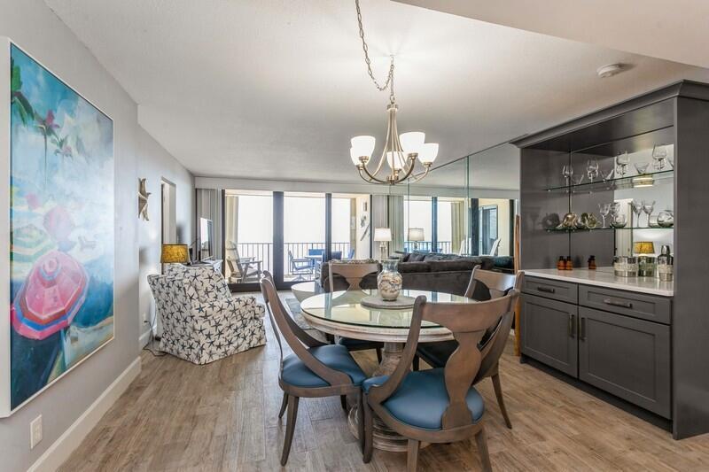 100 Ocean Trail Way, Unit 1010 Jupiter, FL 33477 - Photo 7 of 40 a view of a dining room with furniture window and wooden floor