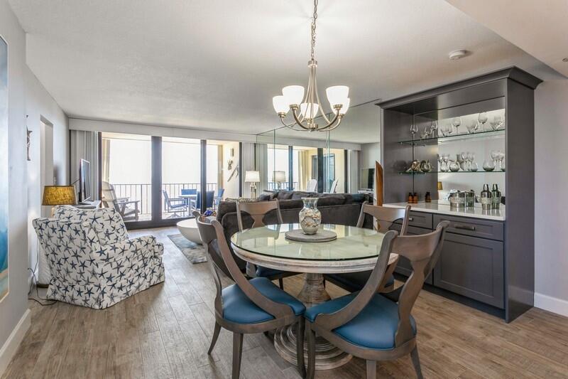 100 Ocean Trail Way, Unit 1010 Jupiter, FL 33477 - Photo 9 of 40 a view of a dining room with furniture window and wooden floor