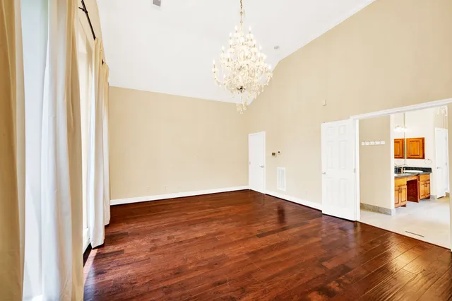 a kitchen with granite countertop cabinets stainless steel appliances a sink and a window