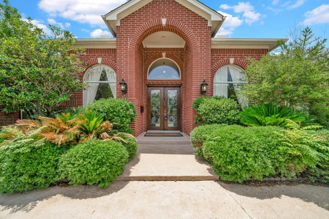 a view of a room with wooden floor and a large window
