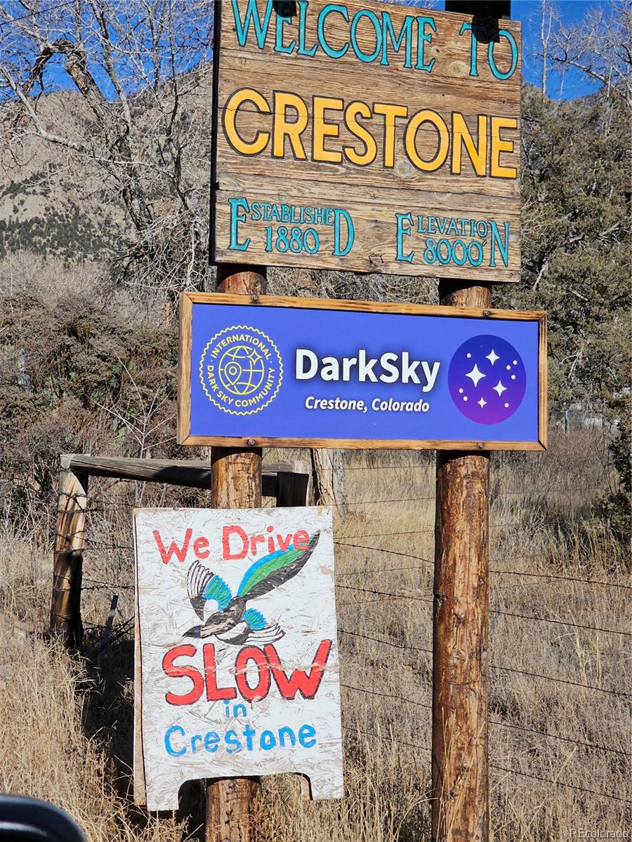 170 Wagon Wheel Road Crestone, CO 81131 - Photo 14 of 20 a street sign that is on a brick wall