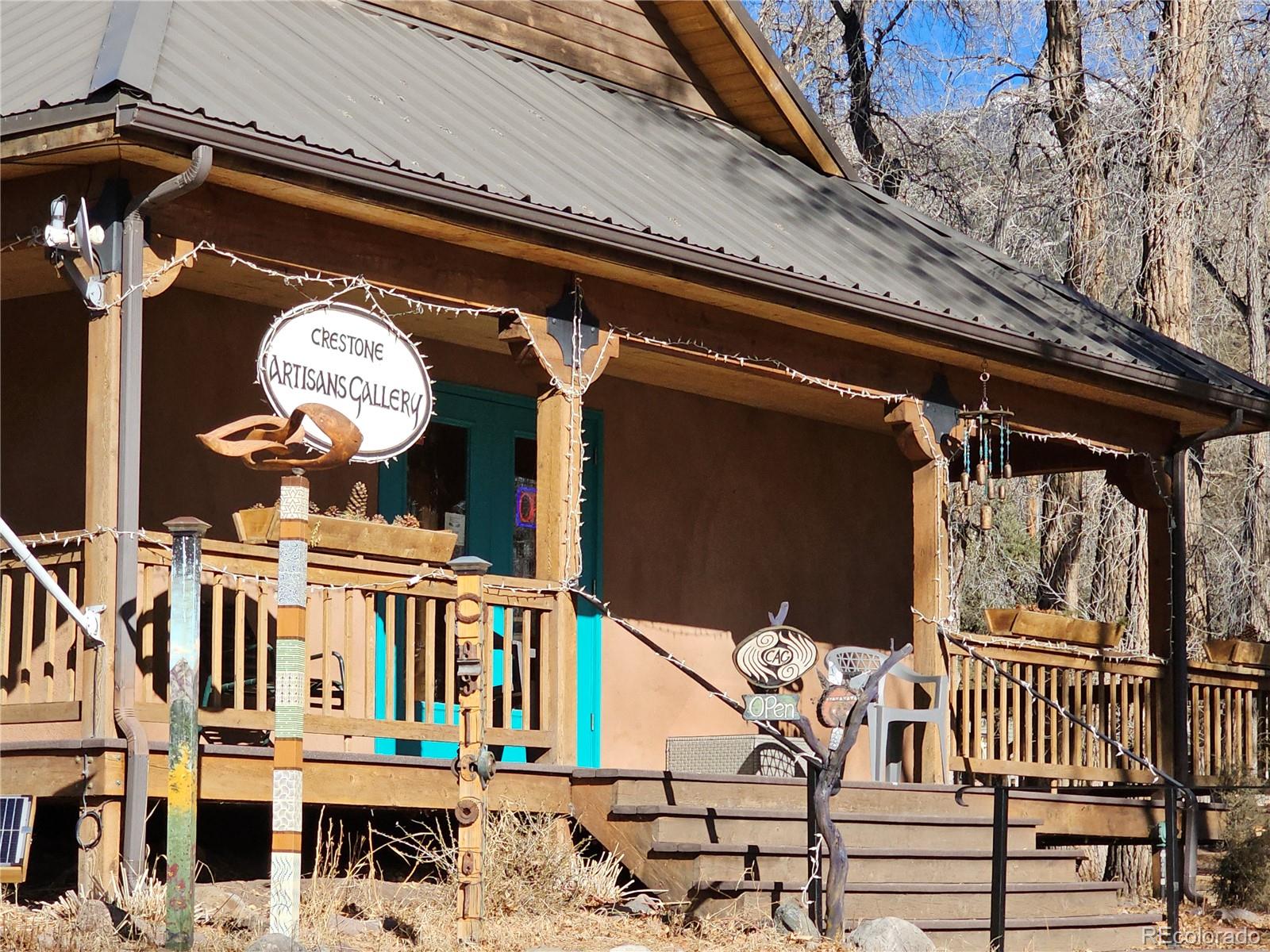 170 Wagon Wheel Road Crestone, CO 81131 - Photo 17 of 20 a front view of a building with balcony