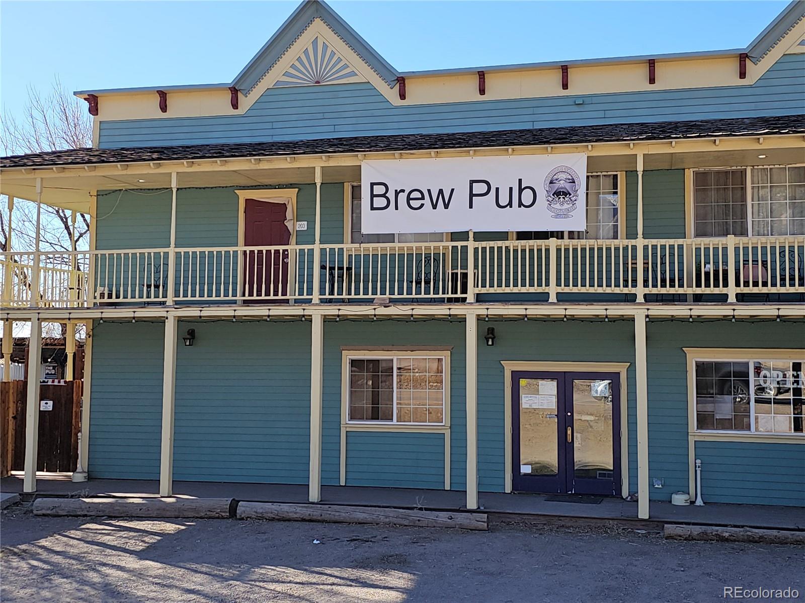 170 Wagon Wheel Road Crestone, CO 81131 - Photo 19 of 20 a view of a brick building with many windows