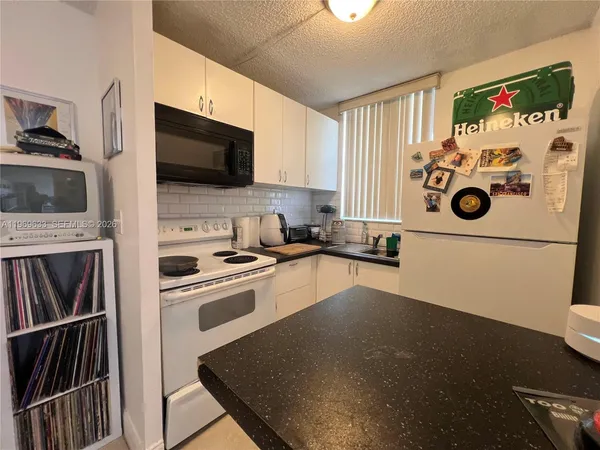 a bedroom with furniture and a book shelf