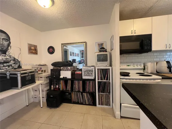 a bedroom with a bed and a desk