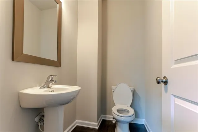 a bathroom with a toilet and a sink