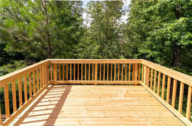 a view of balcony with wooden floor