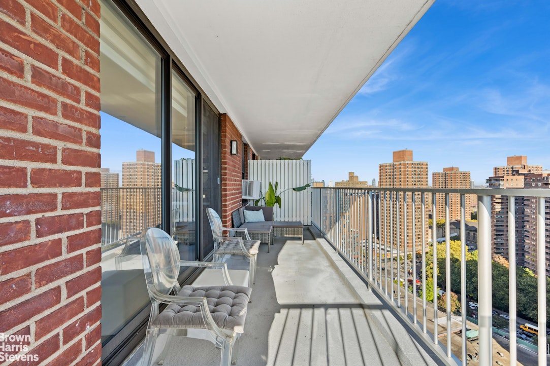 383 Grand Street, Unit M2002 Manhattan, NY 10002 - Photo 4 of 12 a view of balcony with wooden floor and outdoor seating