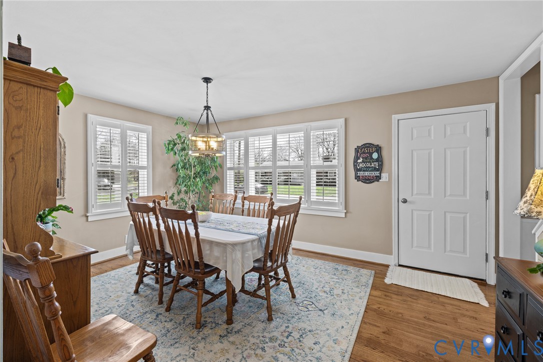 408 John Street Ashland, VA 23005 - Photo 11 of 45 a view of a dining room with furniture window and wooden floor