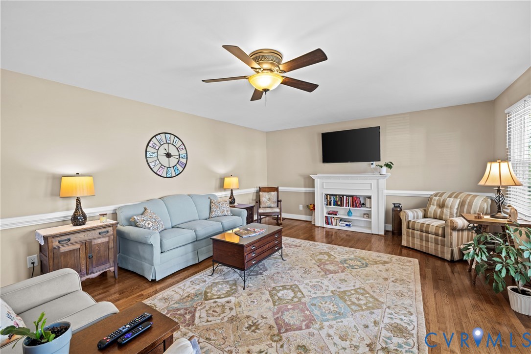 408 John Street Ashland, VA 23005 - Photo 15 of 45 a living room with furniture and a flat screen tv with wooden floor