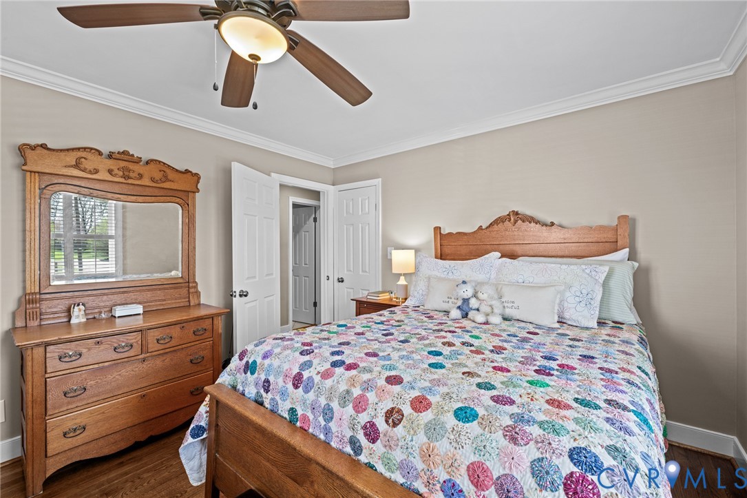 408 John Street Ashland, VA 23005 - Photo 19 of 45 a bedroom with a bed and wooden floor