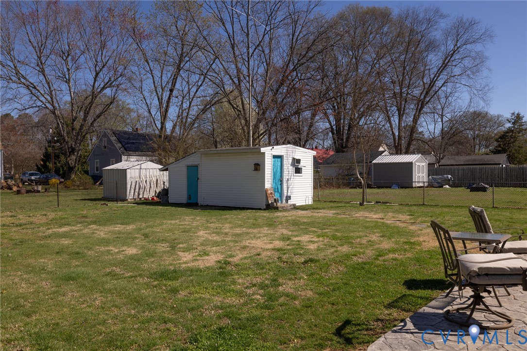 408 John Street Ashland, VA 23005 - Photo 40 of 45 a backyard of a house with table and chairs