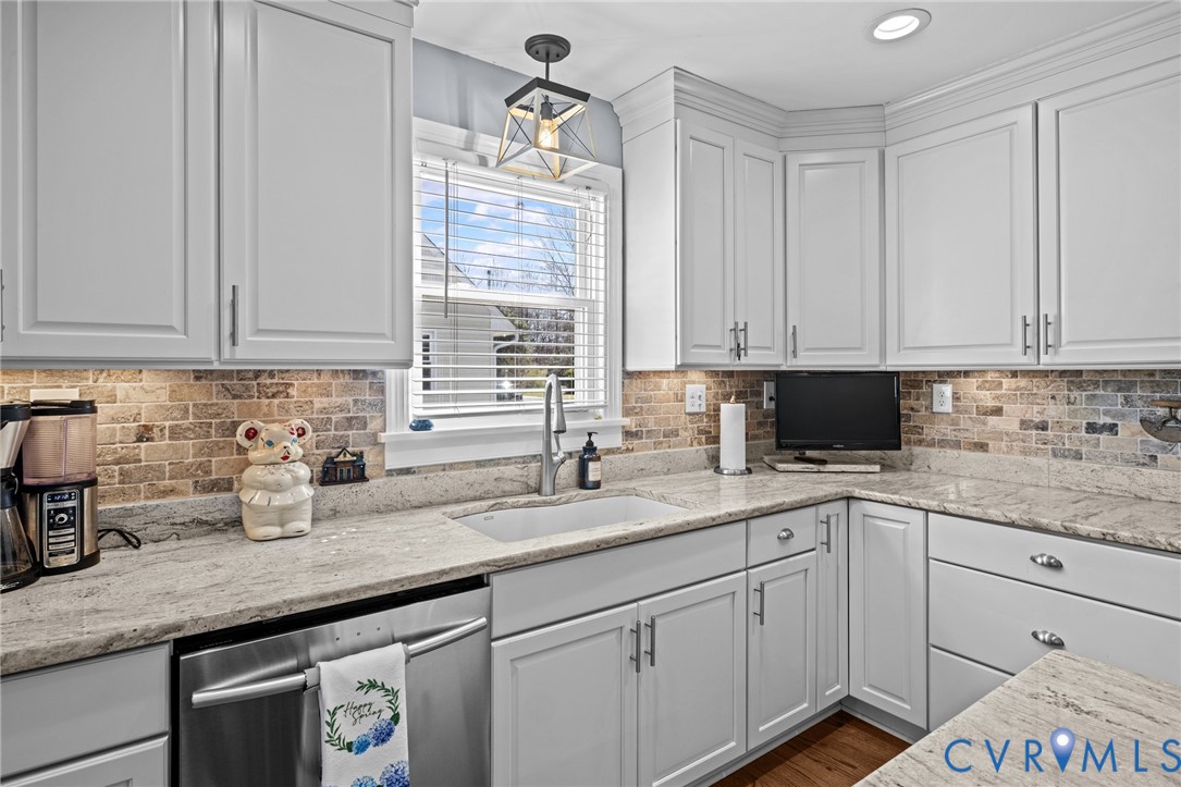 408 John Street Ashland, VA 23005 - Photo 4 of 45 a kitchen with granite countertop a sink stainless steel appliances and cabinets