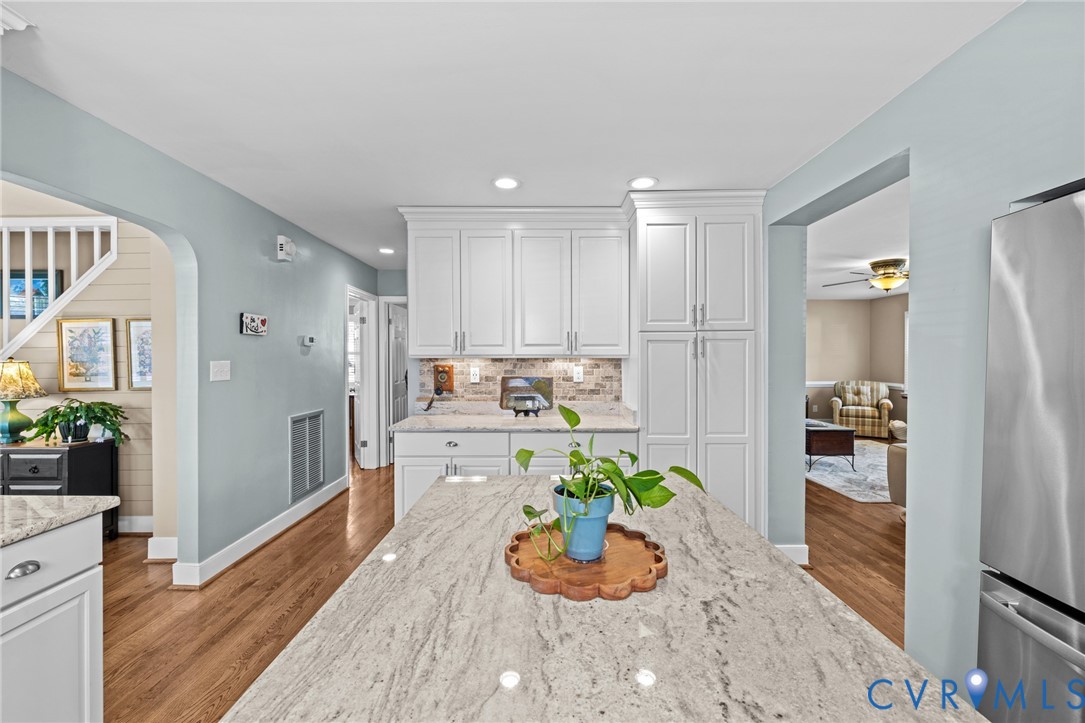408 John Street Ashland, VA 23005 - Photo 5 of 45 a kitchen with a refrigerator and a wooden floor